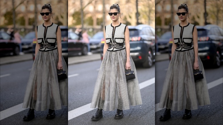 woman wearing a sheer full skirt and vest