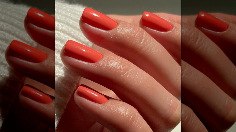 Short orange red gel nails