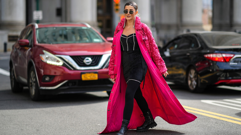 woman wearing pink maxi coat