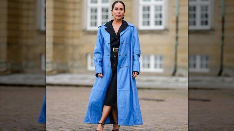 woman wearing blue maxi coat