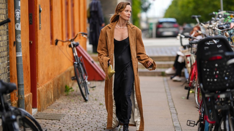 woman wearing suede maxi coat