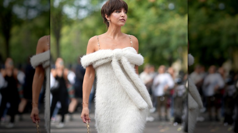 Carla Ginola wearing fuzzy white gown