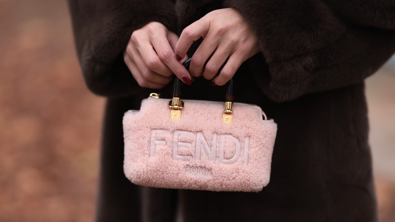 Sonia Lyson carrying fuzzy Fendi handbag