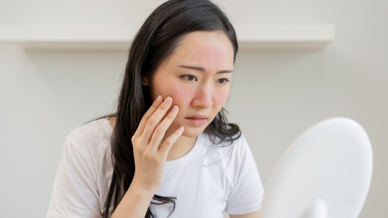 woman looking at red face