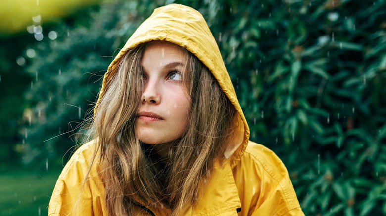 woman feeling cold in rain