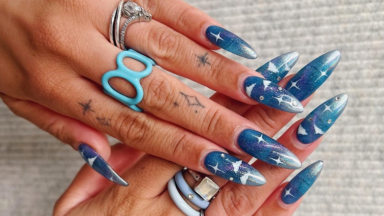 Blue sky nails sparkly manicure