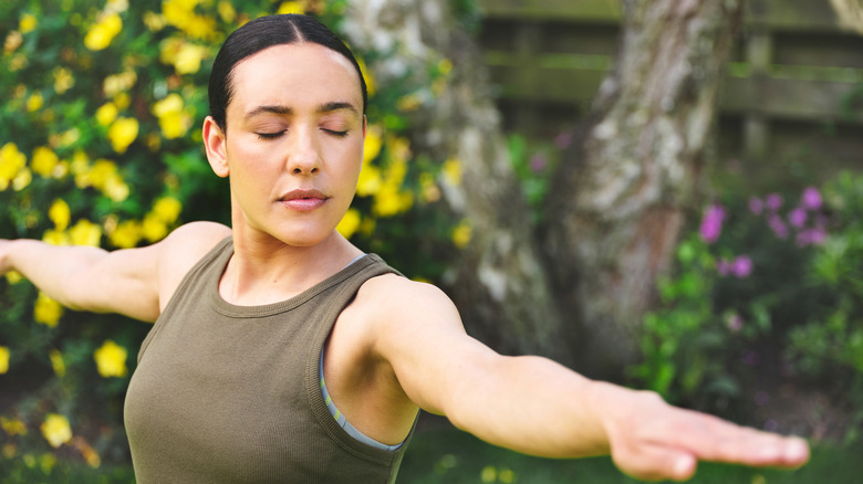 Woman stretching in yard