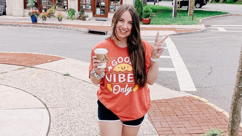 Woman wearing graphic tee from gas station