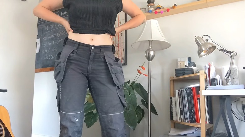Woman wearing gray workwear pants