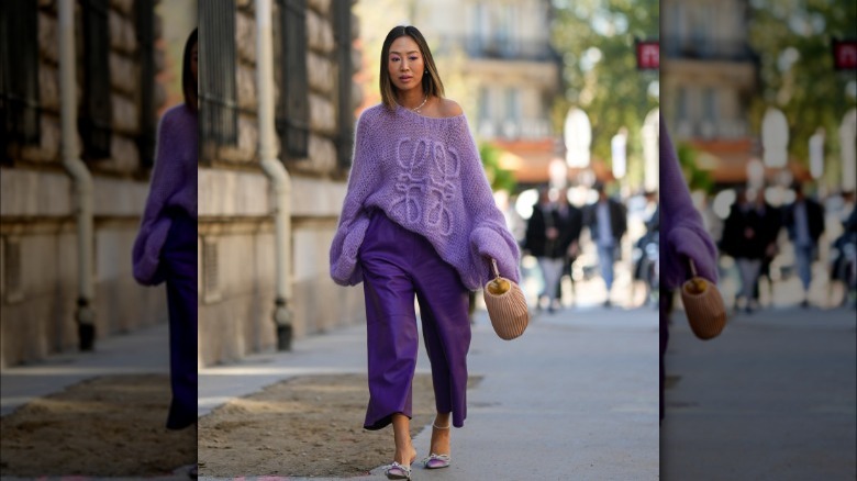 Aimee Song in purple sweater and pants