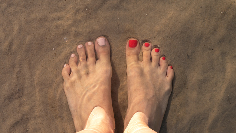 Pedicure with different color of polish on each foot