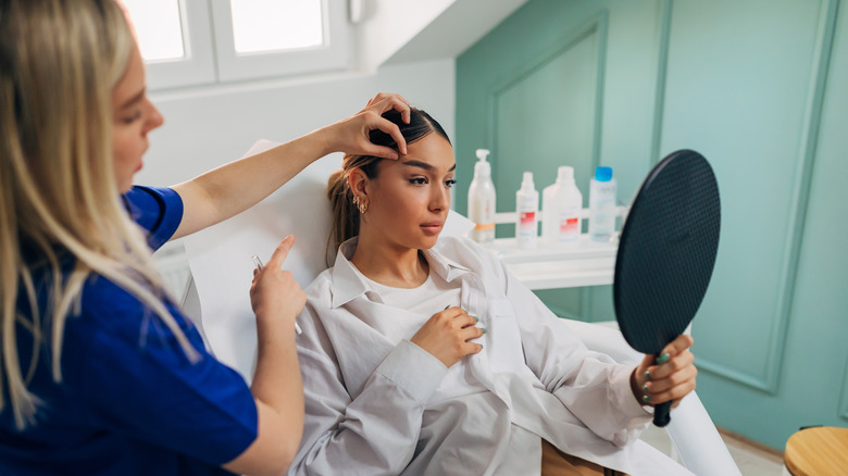 Young woman botox dermatologist