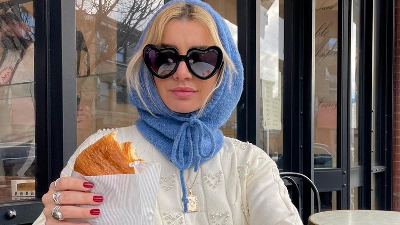 Woman wearing geometric sunglasses