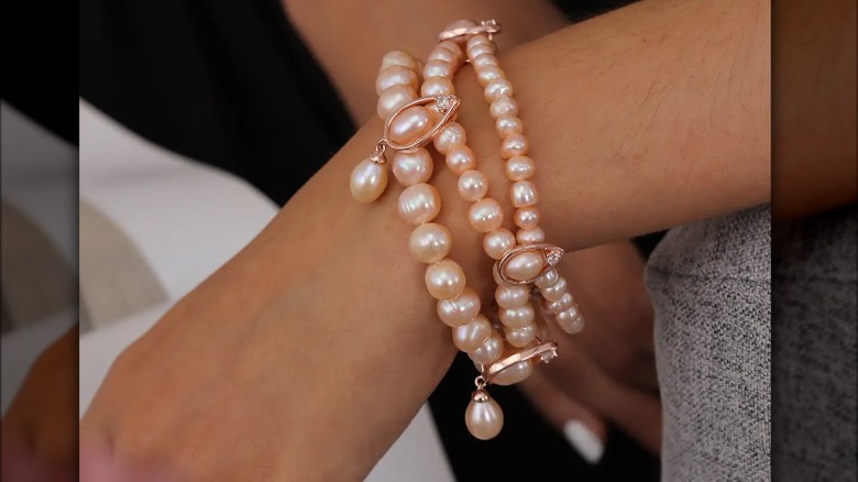 Woman wearing pink pearl bracelet