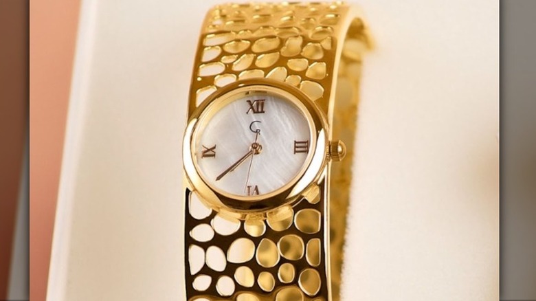 Gold bangle watch