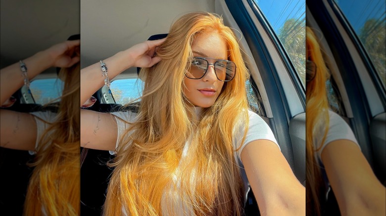 Woman with ginger blond long tresses