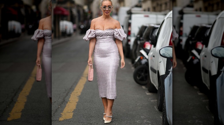 Person in purple gingham dress