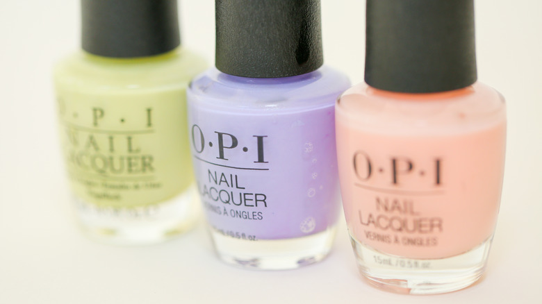 Three bottles of OPI nail polish