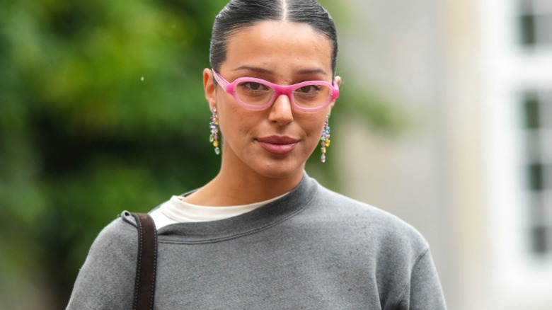 Woman wearing pink glasses