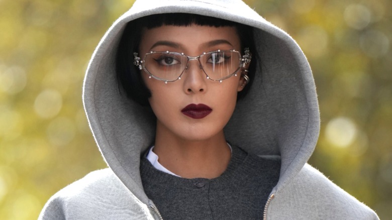 Woman wearing glasses and dark lipstick