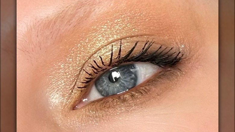 Eyelid with golden glittery eyeshadow