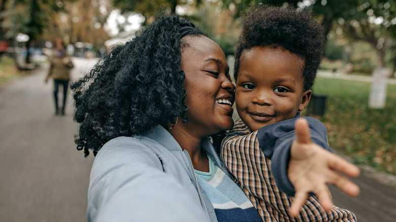 Woman hugging her son