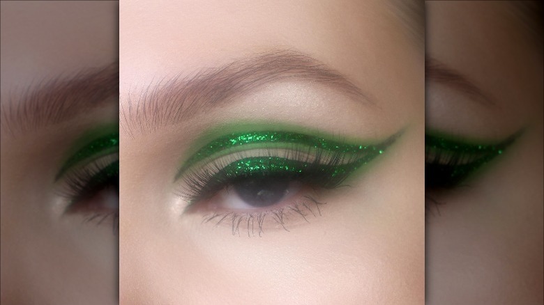 Woman wearing double glitter eyeliner