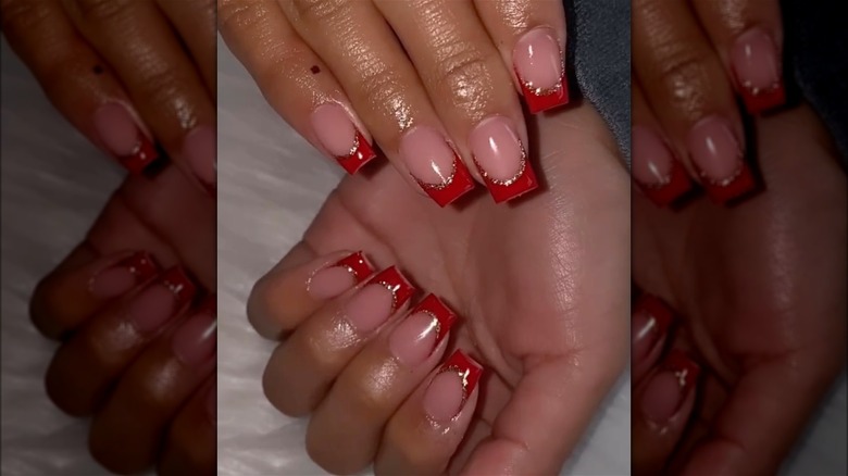 red nails with gold glitter