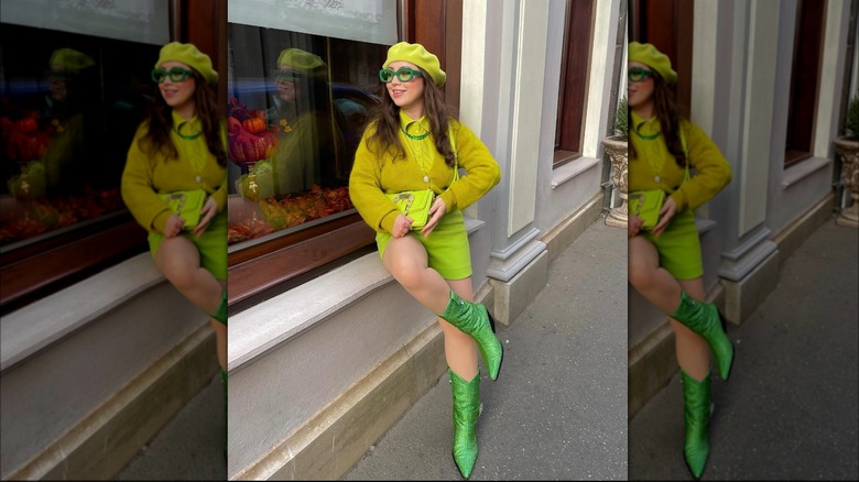 Girl wearing green glittery cowgirl boots