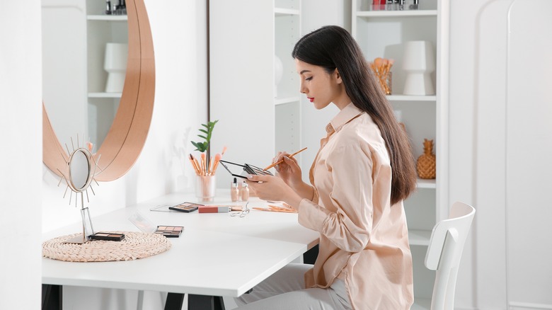 woman getting ready to apply makeup