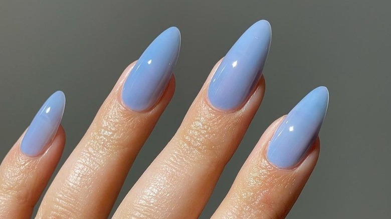 Woman with blueberry milk nails