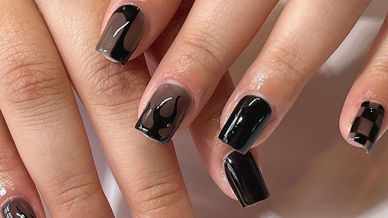 Woman with dark syrup nails