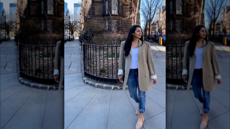 Woman wearing blazer and jeans