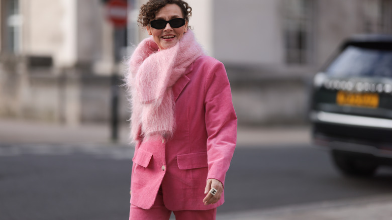 Woman wearing pink scard, pink jacket, pink pants