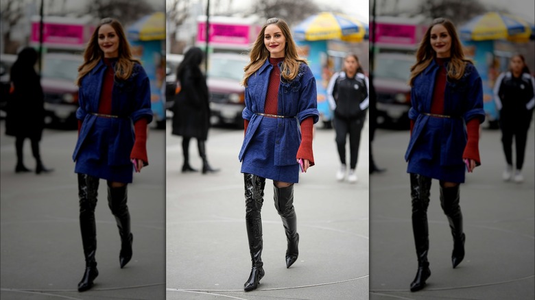 Woman wearing denim skirt, shirt and over the knee boots