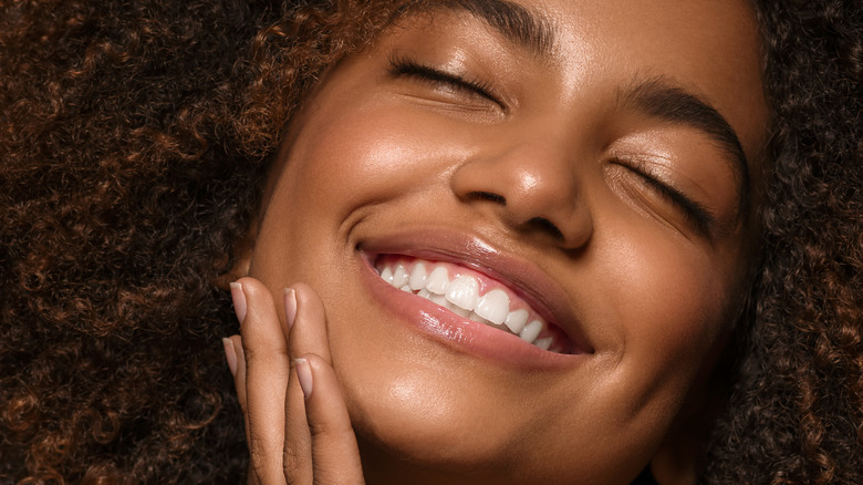 woman radiant skin smiling