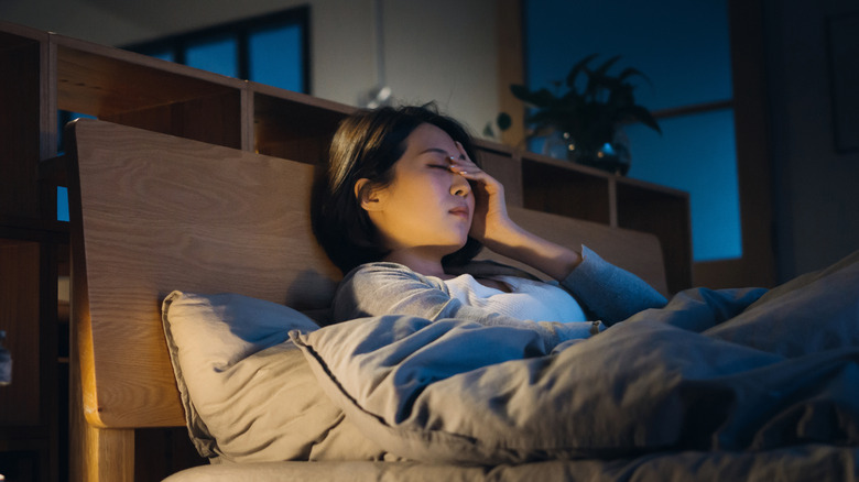 stressed woman in bed