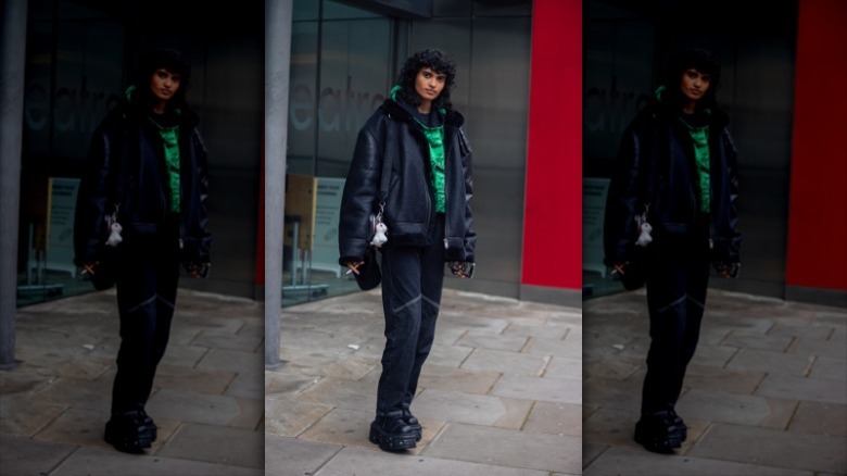 woman wearing oversized look with chunky boots