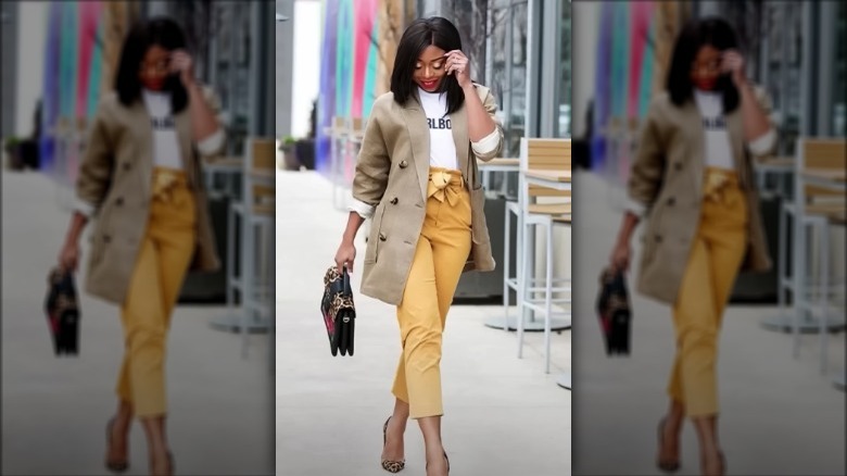 Woman wearing yellow dress pants