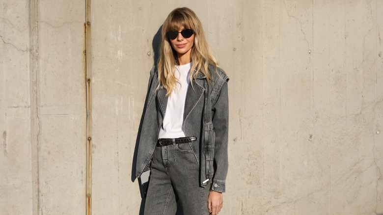 Woman wearing gray jeans, jacket