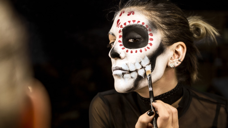 Woman doing Halloween makeup