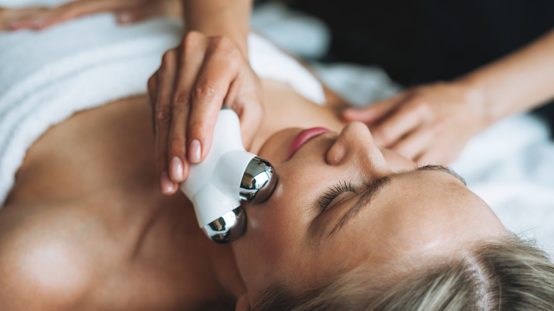 Woman being treated with NuFace microcurrent device