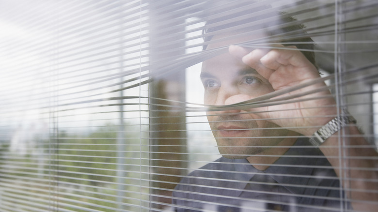 person looking out window