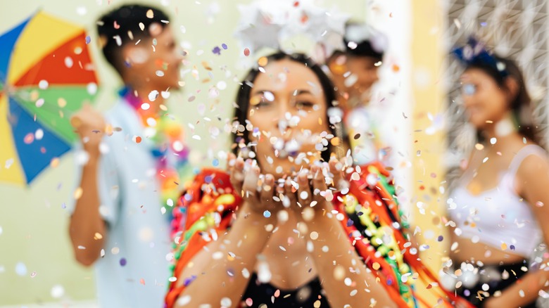 happy woman blowing decorations