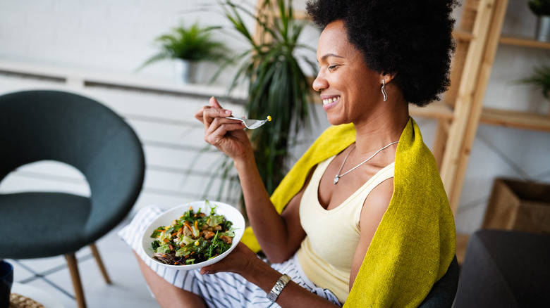 woman eating salad