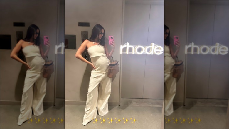 Pregnant Hailey Bieber in white outfit