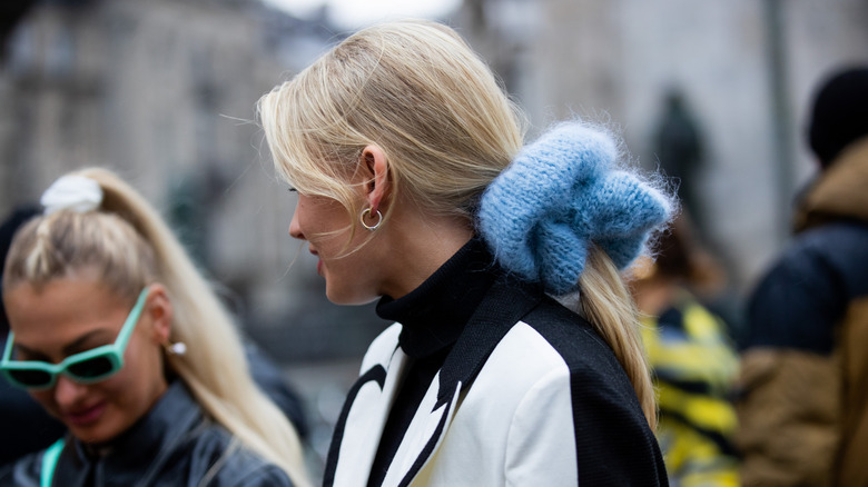 woman wearing oversized scrunchie