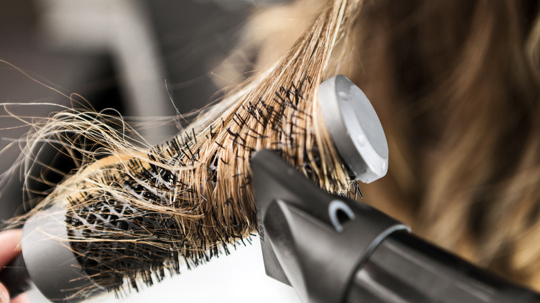 woman having her hair blow dried