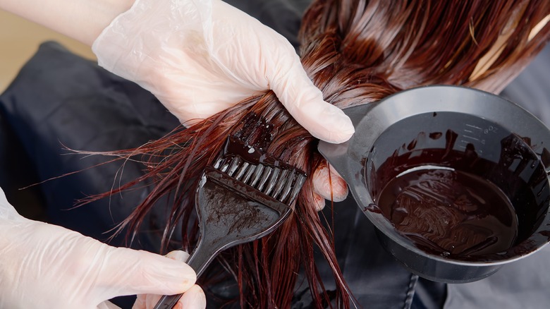 Woman getting her hair dyed 