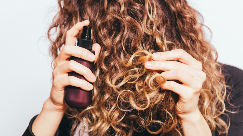 using oil on curly hair